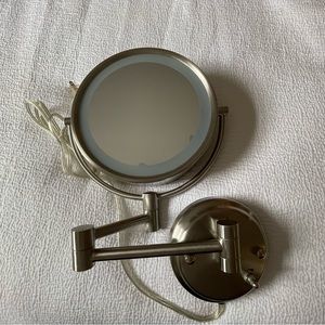 Wall mounted lighted 10x magnifying mirror, double sided